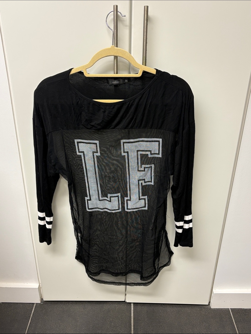 LF Black Sheer Long Sleeve Top with White Lettering and Striped Cuffs